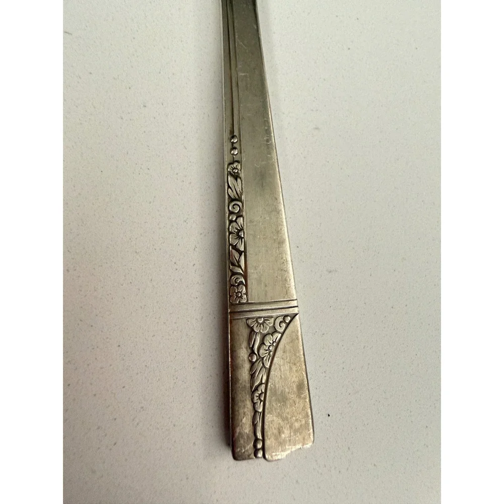 vintage Oneida Nobility silverplate butter knife in the Caprice pattern